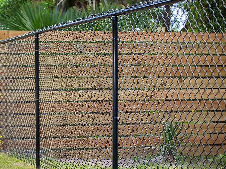 Chain link fence with wood privacy slats — versatile fencing options in Birmingham AL
